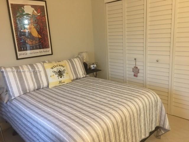 6783 Bridlewood Court, Unit 6783 Boca Raton, FL 33433 - Photo 24 of 56 a bedroom with a bed and wall painting