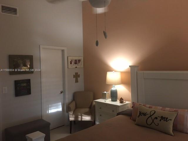 6783 Bridlewood Court, Unit 6783 Boca Raton, FL 33433 - Photo 31 of 56 a living room with furniture a lamp and a fireplace