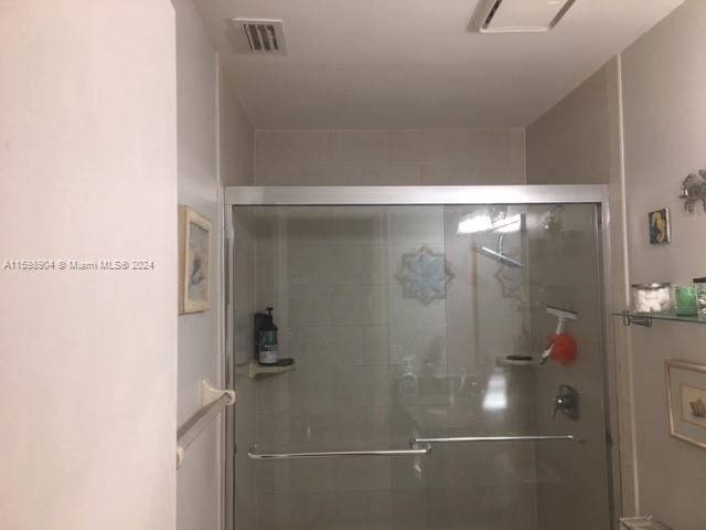 6783 Bridlewood Court, Unit 6783 Boca Raton, FL 33433 - Photo 34 of 56 a bathroom with a glass shower door