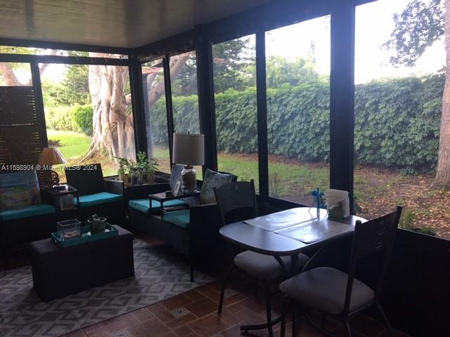 6783 Bridlewood Court, Unit 6783 Boca Raton, FL 33433 - Photo 39 of 56 a living room with furniture and floor to ceiling windows