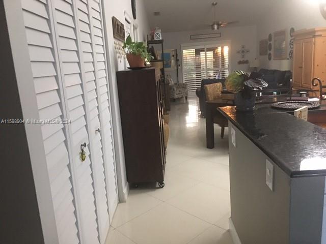 6783 Bridlewood Court, Unit 6783 Boca Raton, FL 33433 - Photo 4 of 56 a kitchen with a sink and refrigerator