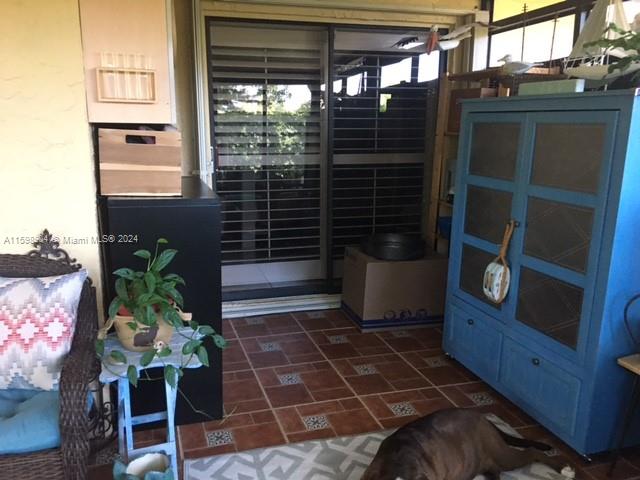 6783 Bridlewood Court, Unit 6783 Boca Raton, FL 33433 - Photo 41 of 56 a view of a door and chair in the patio