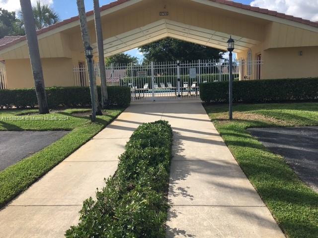 6783 Bridlewood Court, Unit 6783 Boca Raton, FL 33433 - Photo 54 of 56 a front view of a house with a yard