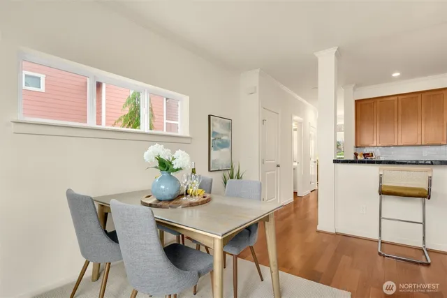 a view of a dining room with furniture and wooden floor