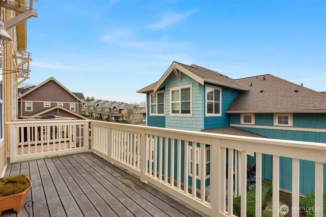 a view of a house with wooden deck