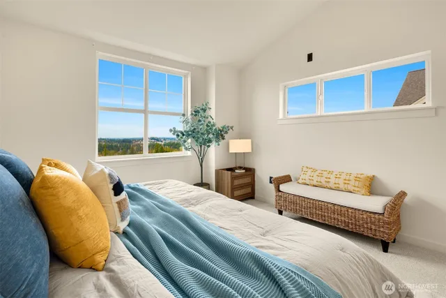 a bedroom with a bed and a couch