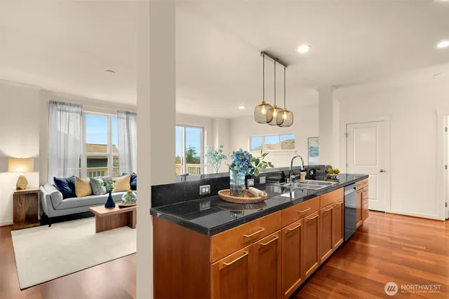 a very nice looking kitchen with granite countertop a large counter top space