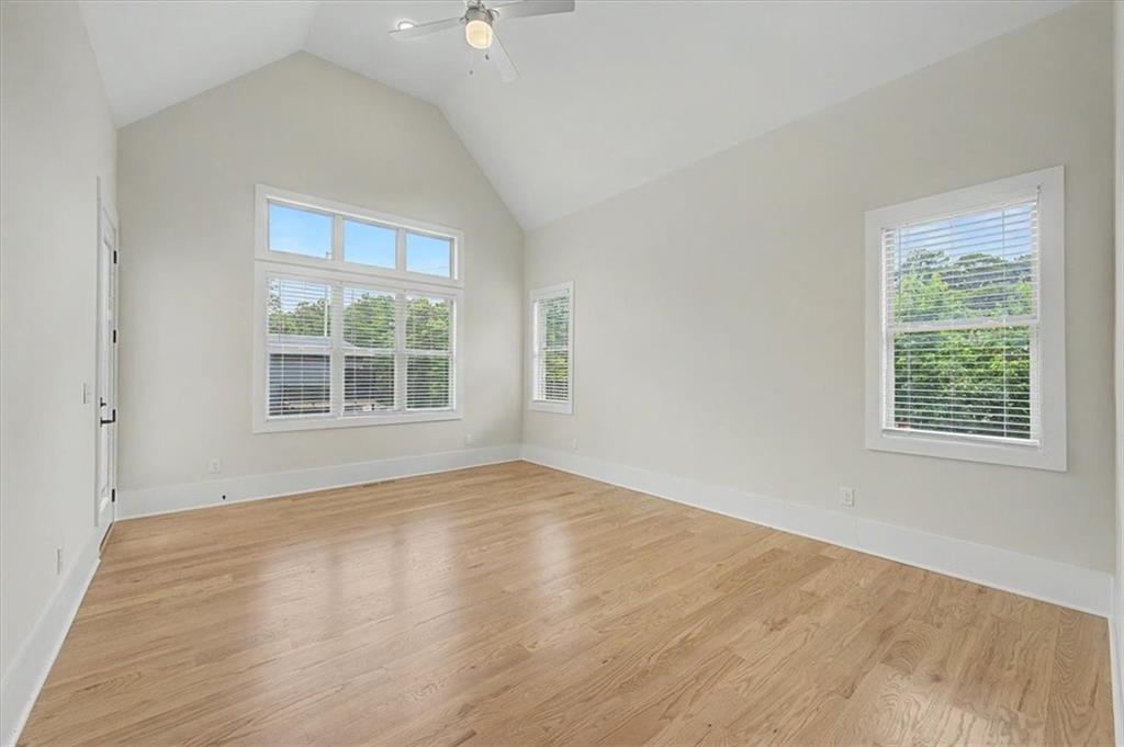 217 Laura Lake Road Marietta, GA 30066 - Photo 30 of 54 an empty room with wooden floor and windows