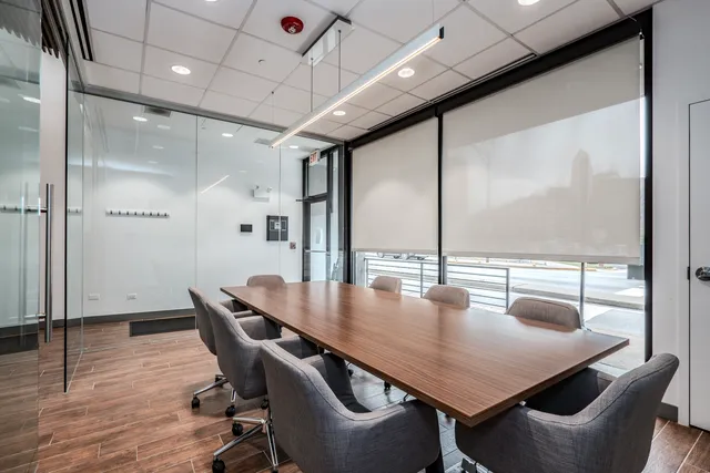 a dining room with furniture and wooden floor