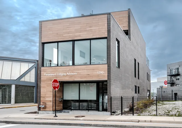 a front view of a building with garage