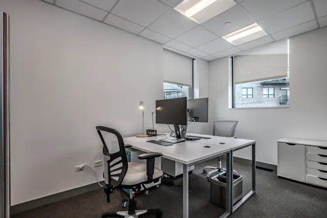 a view of a workspace with furniture