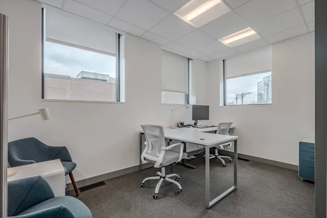 a workspace with furniture and window