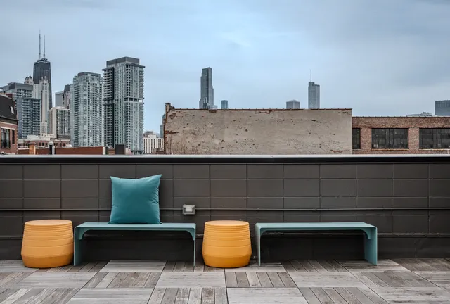 a view of table and chair with lamp