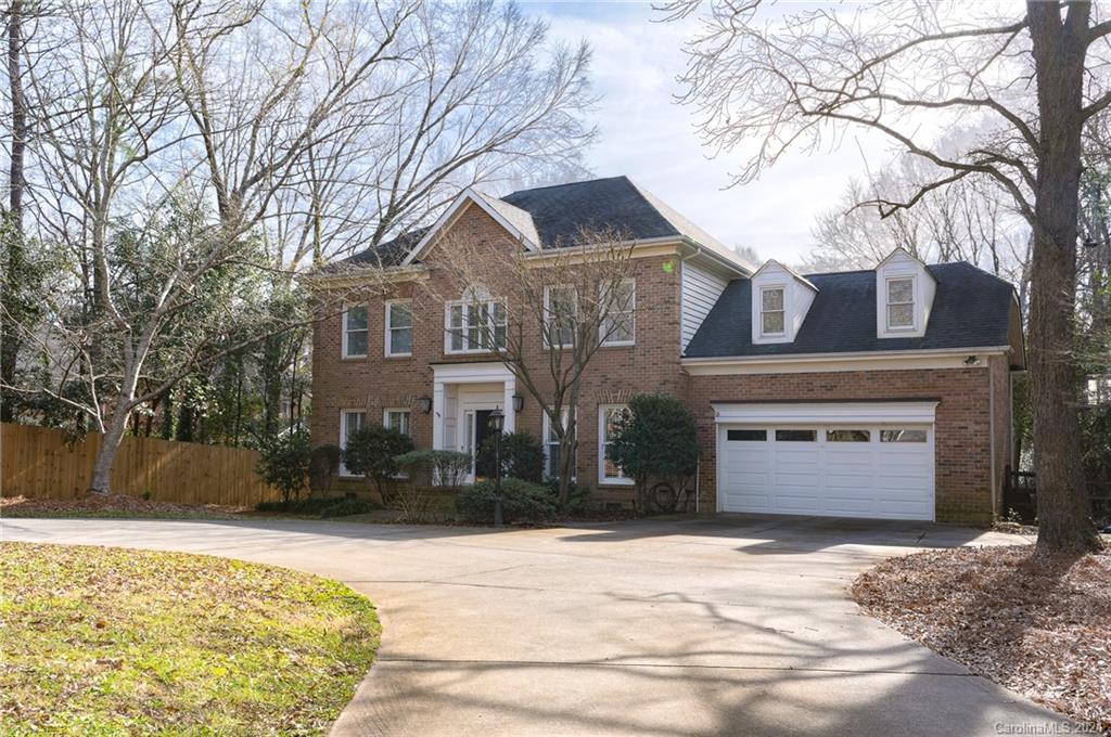 6724 Alexander Road Charlotte, NC 28270 - Photo 1 of 28 a front view of a house with a yard and garage