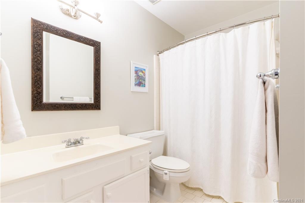 6724 Alexander Road Charlotte, NC 28270 - Photo 23 of 28 a bathroom with a sink a toilet and vanity