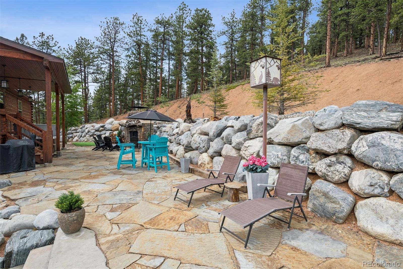 2894 County Road 43 Bailey, CO 80421 - Photo 29 of 40 a view of a terrace with sitting area