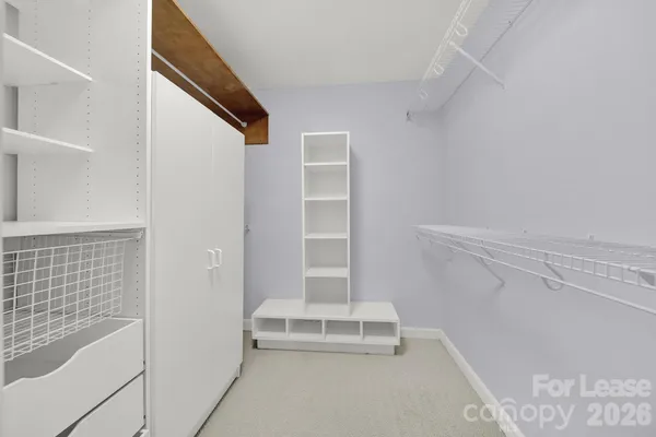 a view of staircase with white walls
