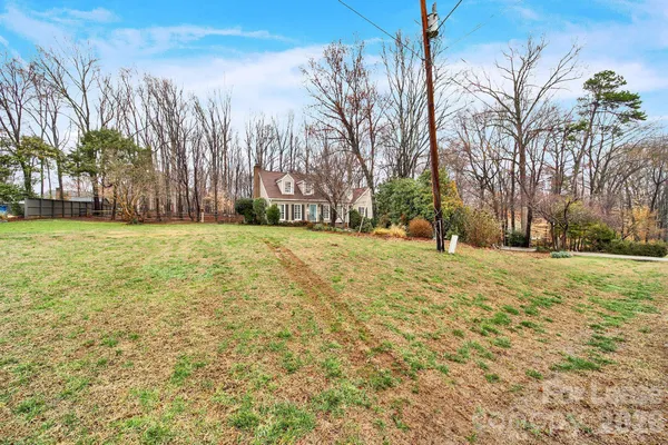 a view of a yard with trees