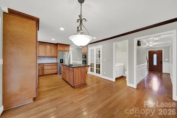 a view of kitchen with wooden floor and window