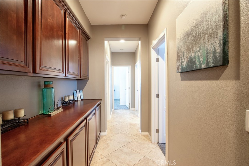 28483 Nautical Point Circle Menifee, CA 92585 - Photo 16 of 44 a kitchen with stainless steel appliances granite countertop a refrigerator and a sink