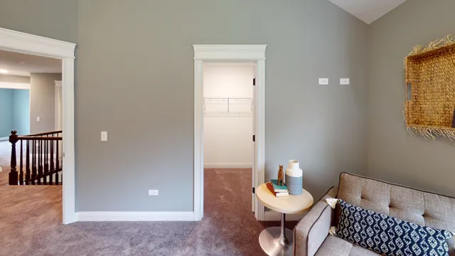 a living room with furniture and a lamp