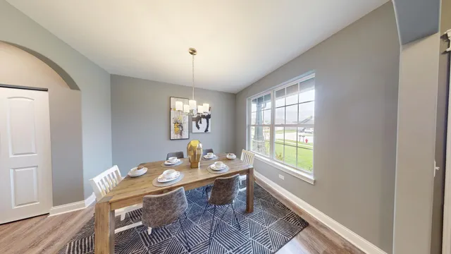 a workspace with wooden floor and a window