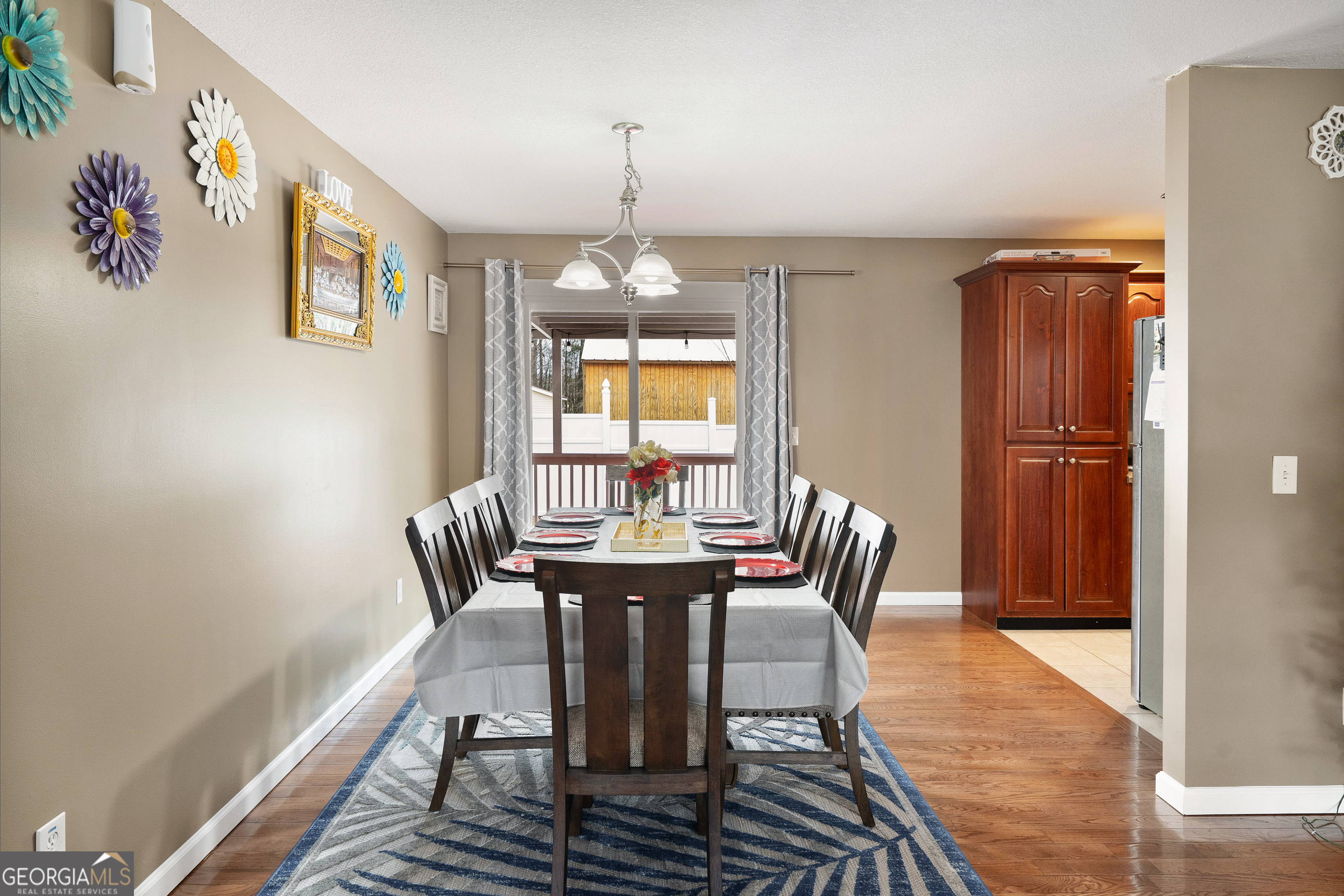 80 Columbus Street Chatsworth, GA 30705 - Photo 13 of 40 a view of a dining room with furniture window and wooden floor