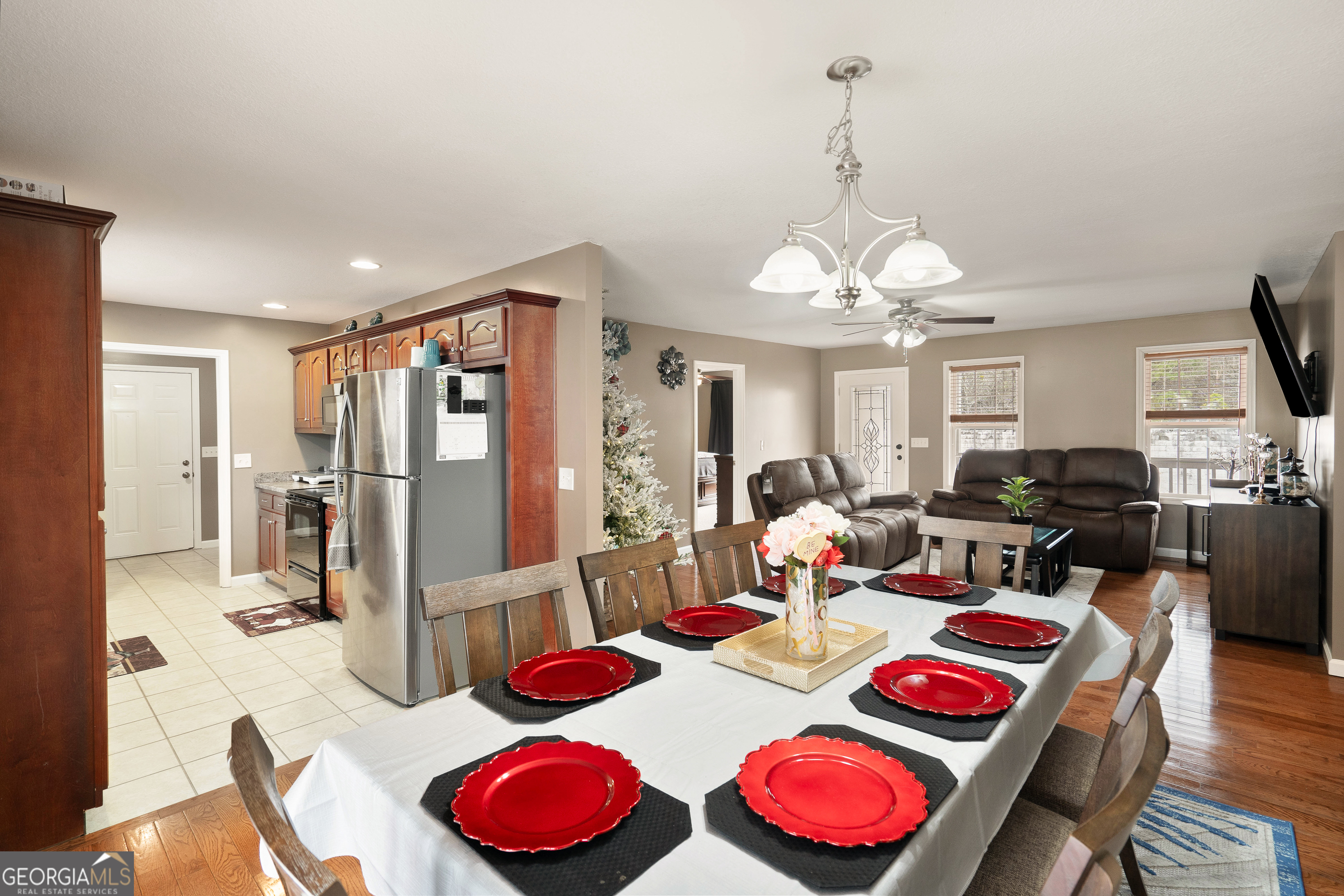 80 Columbus Street Chatsworth, GA 30705 - Photo 14 of 40 a view of a dining room with furniture a chandelier and wooden floor