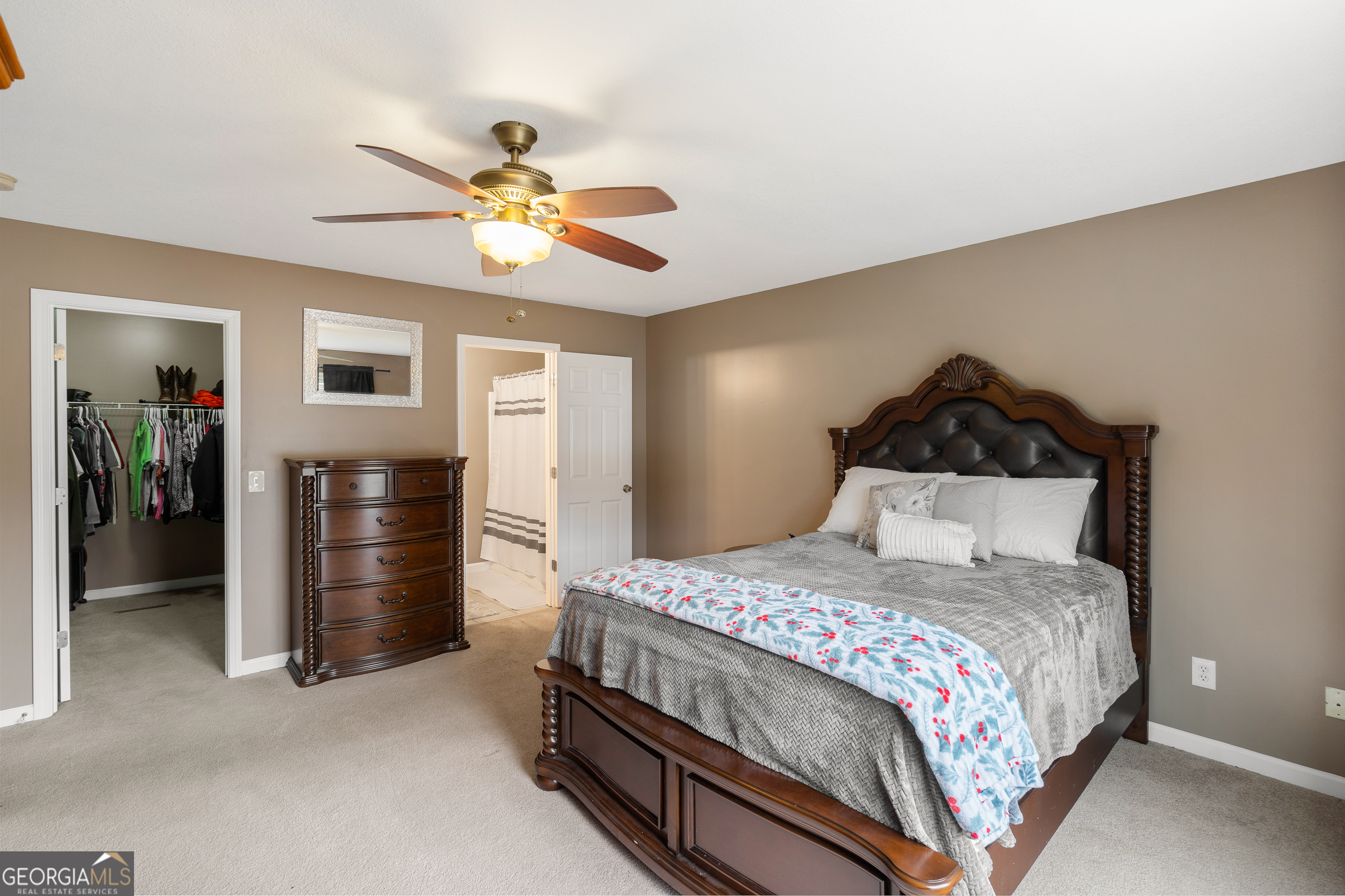 80 Columbus Street Chatsworth, GA 30705 - Photo 22 of 40 a bedroom with a bed and a chandelier