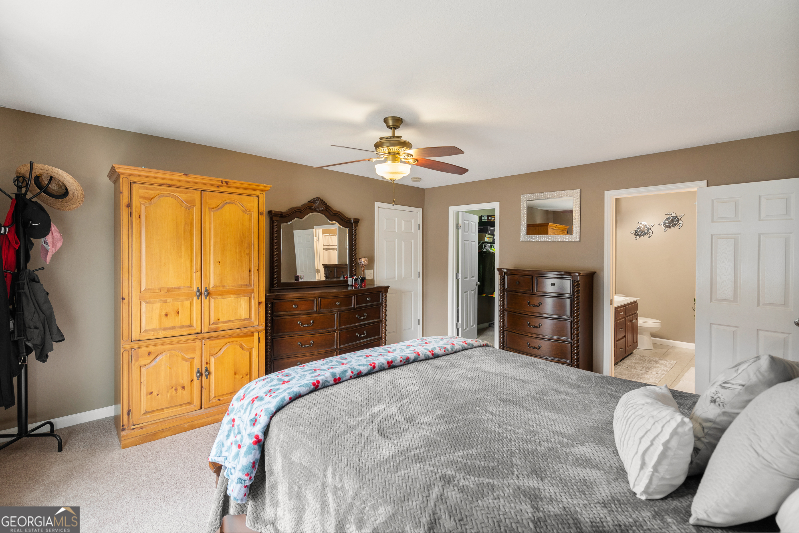 80 Columbus Street Chatsworth, GA 30705 - Photo 23 of 40 a bedroom with a bed and a chandelier