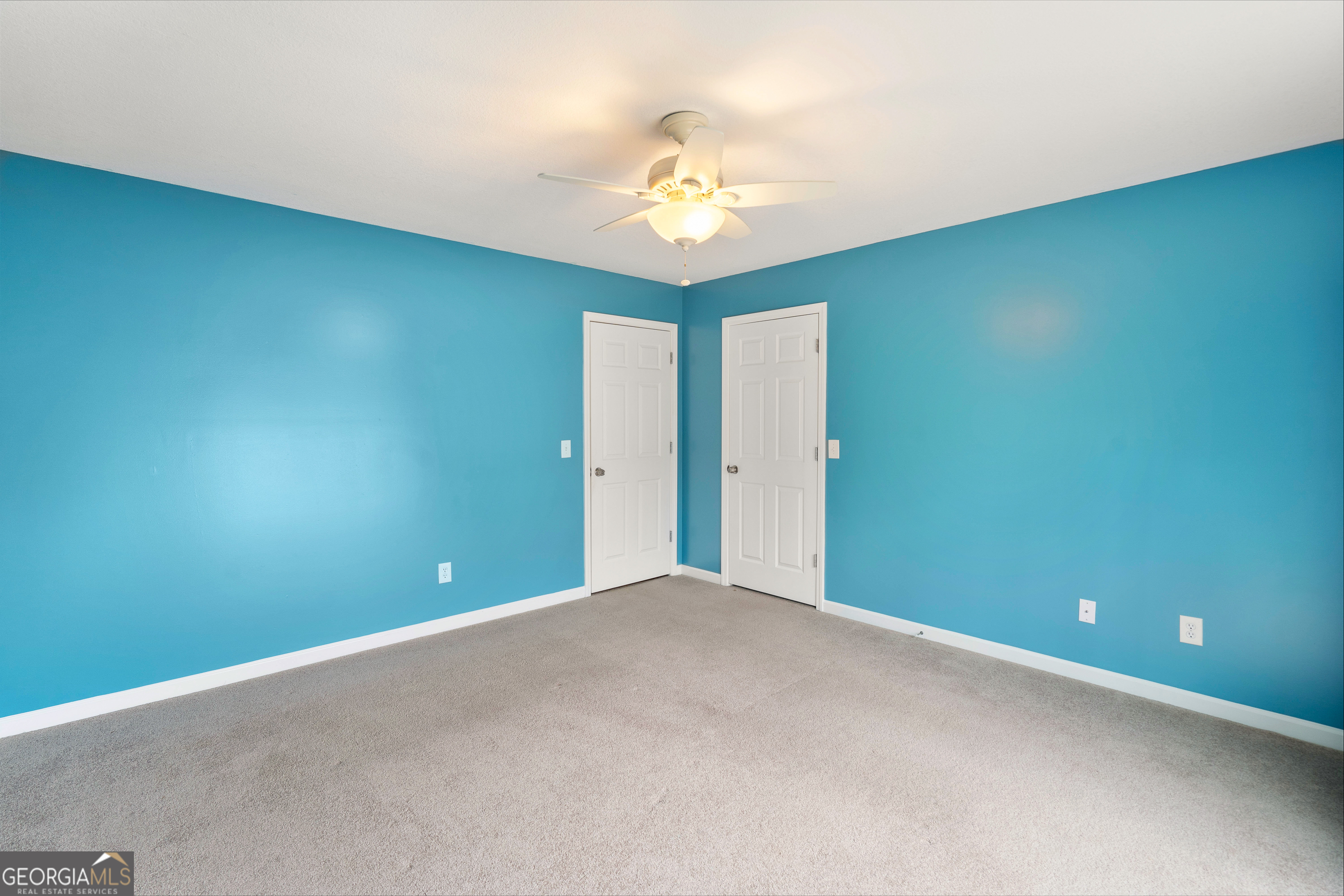 80 Columbus Street Chatsworth, GA 30705 - Photo 28 of 40 a view of an empty room with a chandelier fan