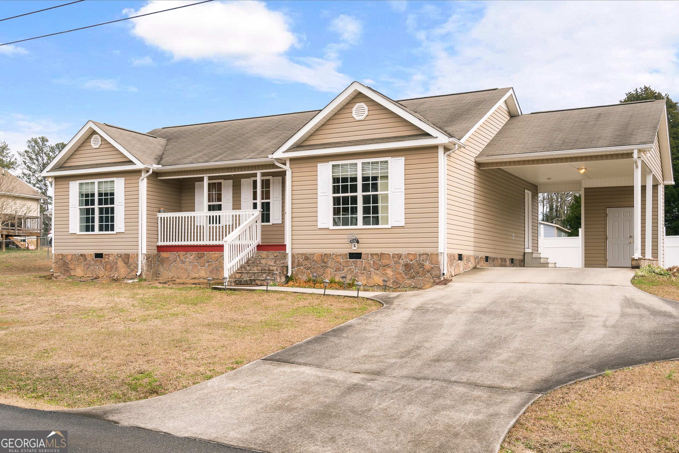80 Columbus Street Chatsworth, GA 30705 - Photo 3 of 40 a front view of a house with a yard