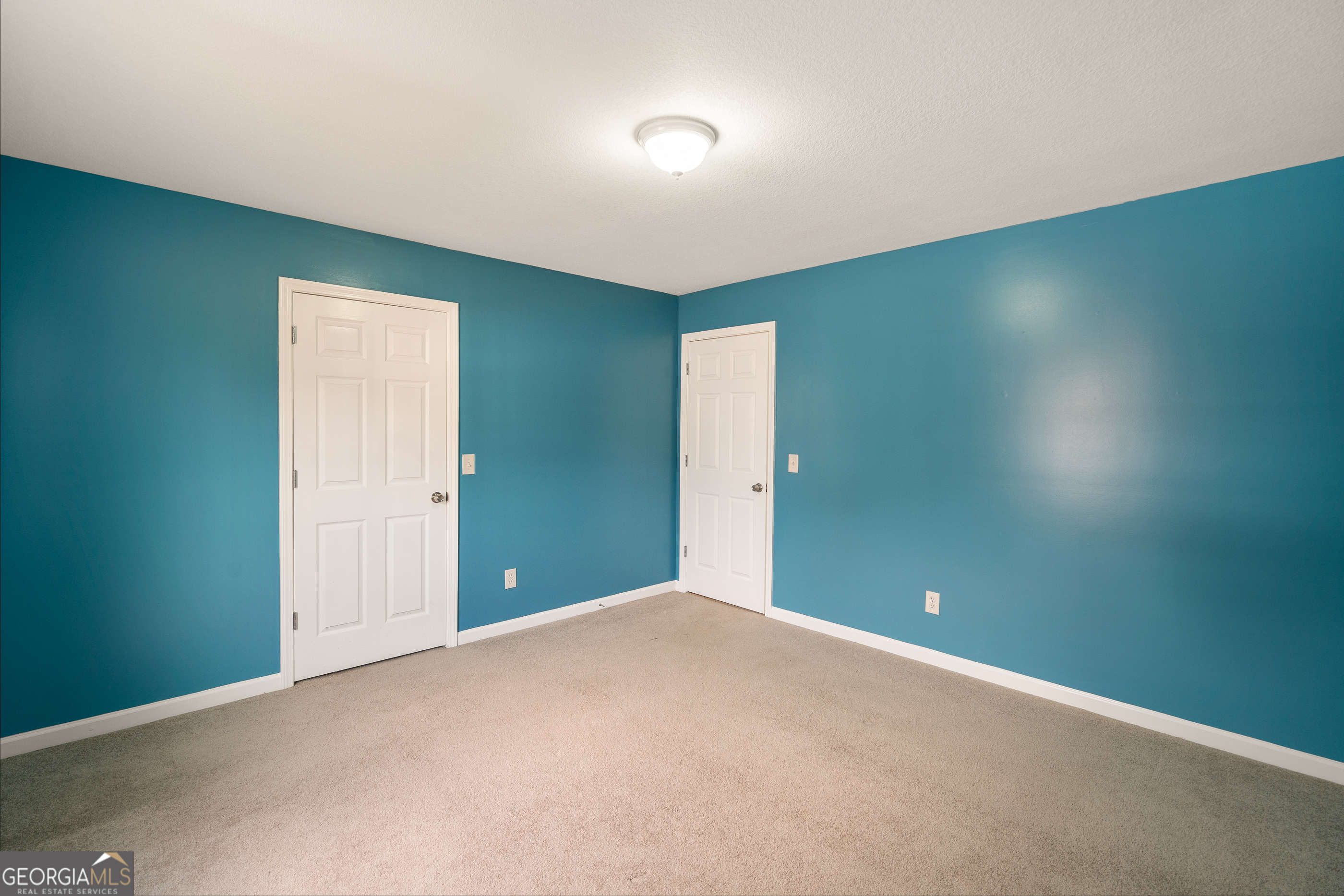 80 Columbus Street Chatsworth, GA 30705 - Photo 31 of 40 an empty room with closet and windows