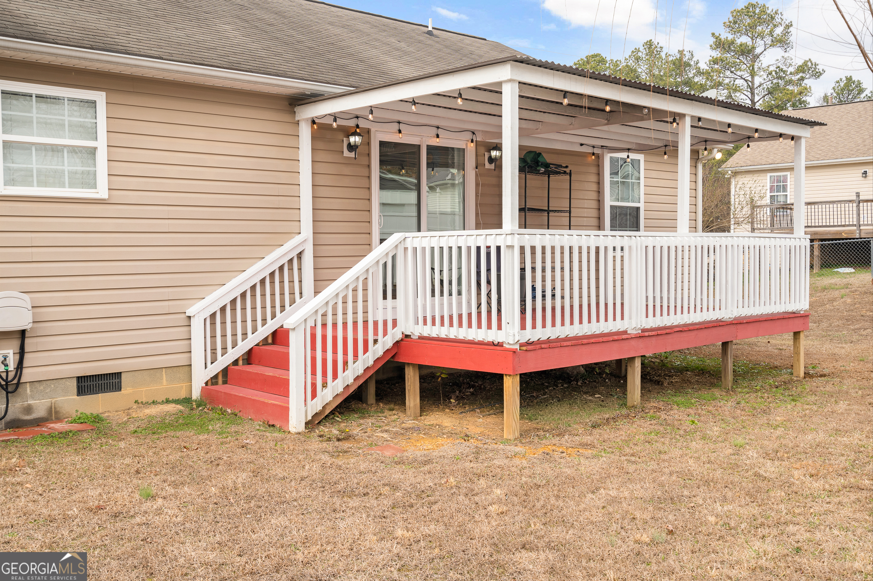 80 Columbus Street Chatsworth, GA 30705 - Photo 36 of 40 a backyard of a house with a deck and deck