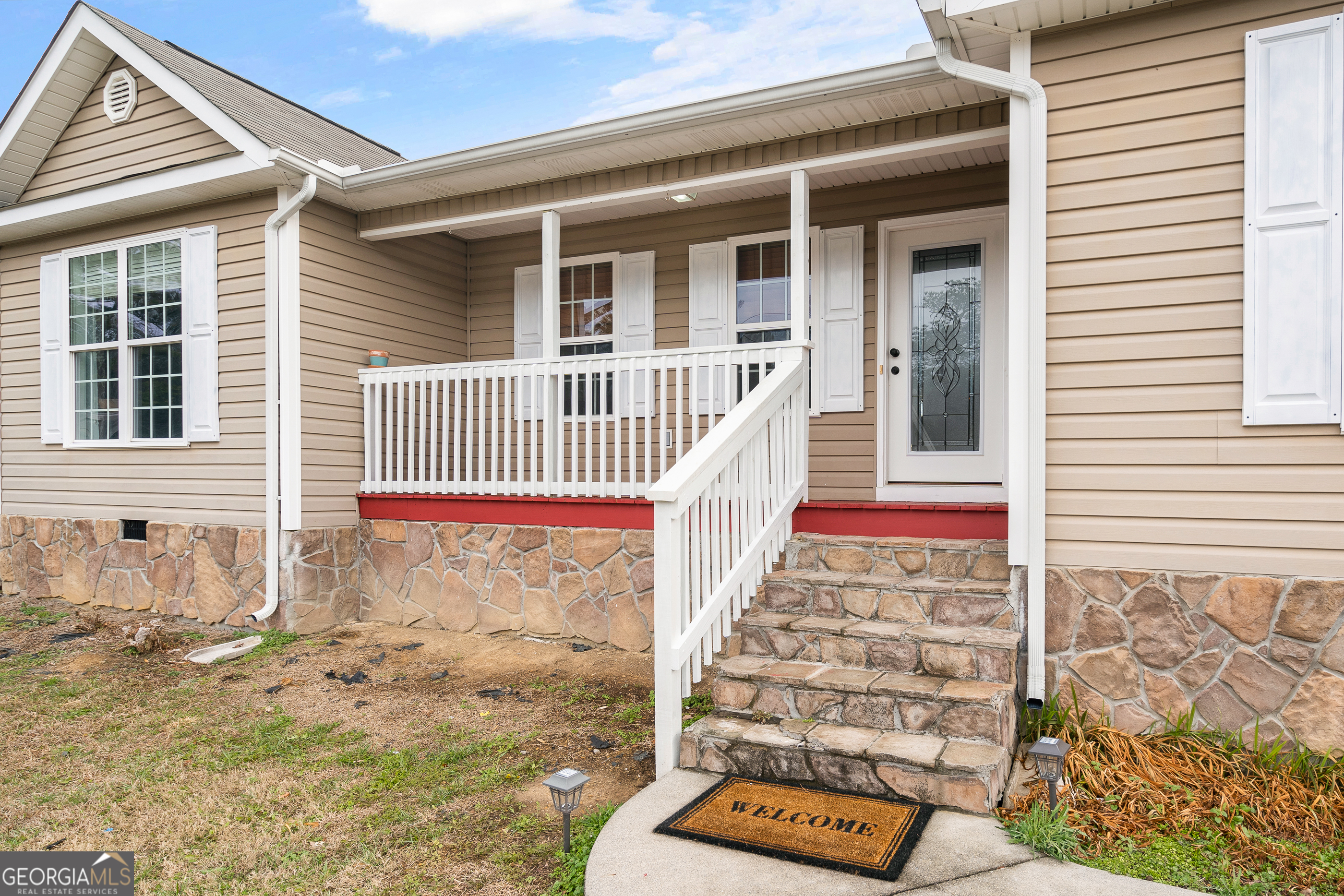 80 Columbus Street Chatsworth, GA 30705 - Photo 5 of 40 front view of a house with wooden fence