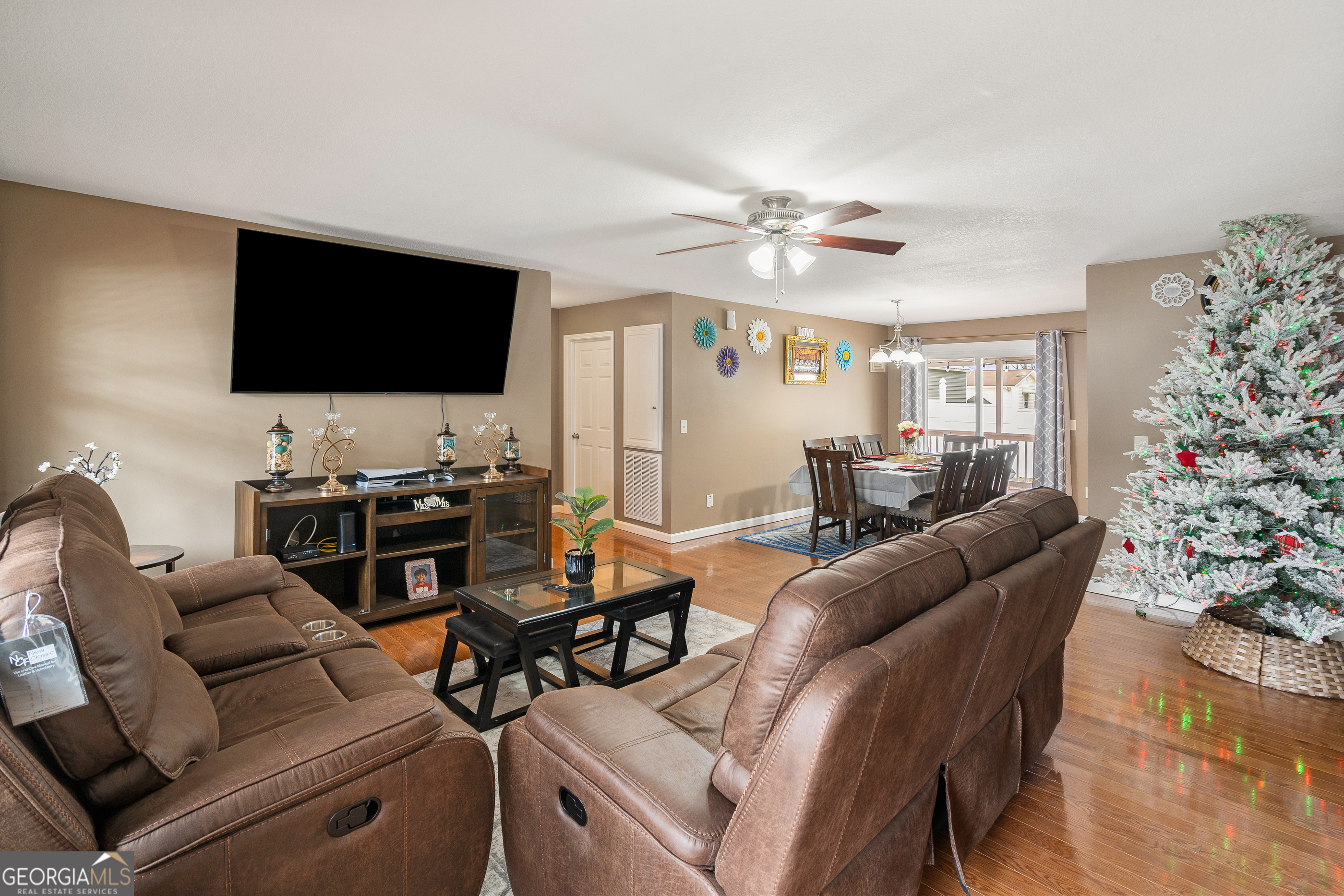 80 Columbus Street Chatsworth, GA 30705 - Photo 8 of 40 a living room with furniture a flat screen tv and a window