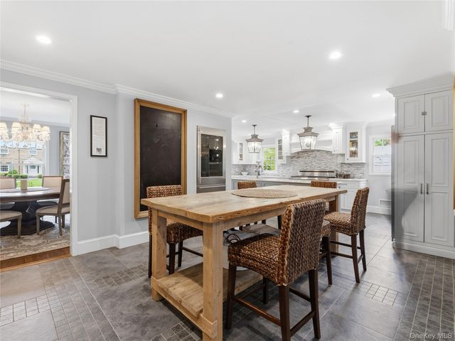 a kitchen with a table and chairs in it