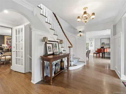 a view of entryway livingroom and hall with wooden floor