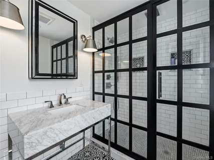 a bathroom with a sink and a window