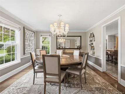 a view of a dining room with furniture window and outside view