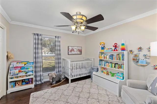 a bedroom with furniture and a book shelf