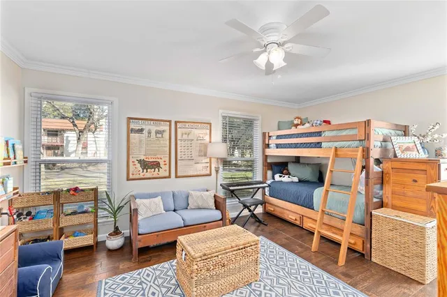 a bedroom with furniture and a chandelier