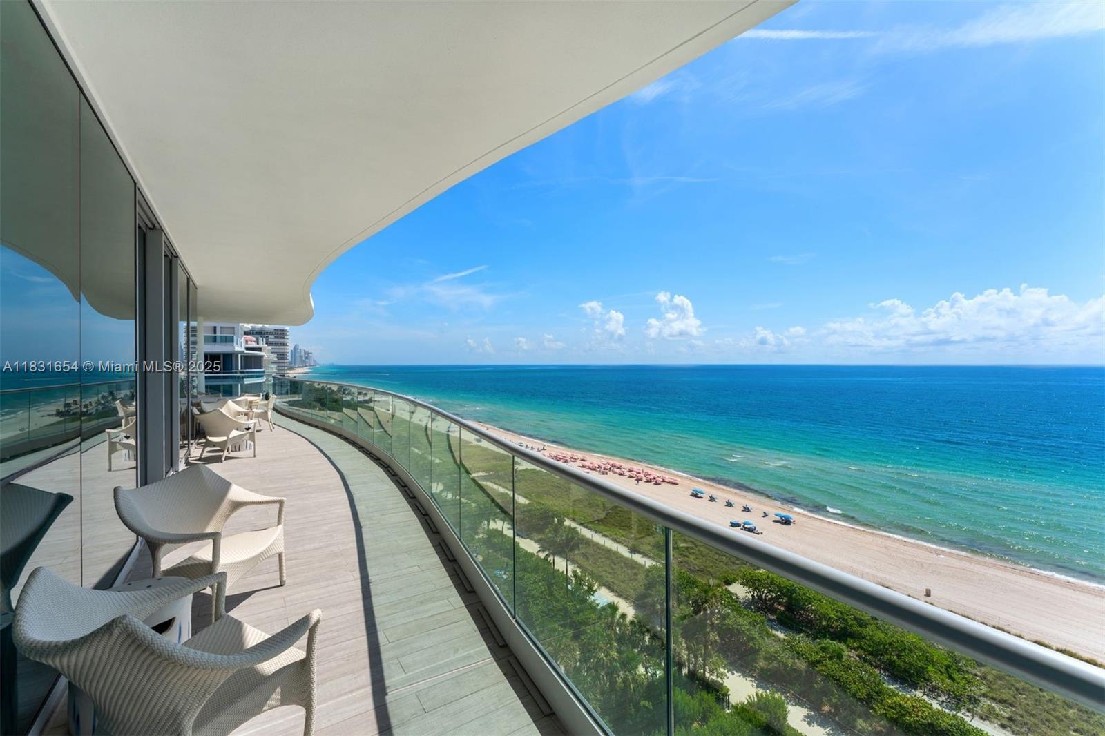 9349 Collins Avenue, Unit 1101 Surfside, FL 33154 - Photo 26 of 37 a view of swimming pool with a table and chairs