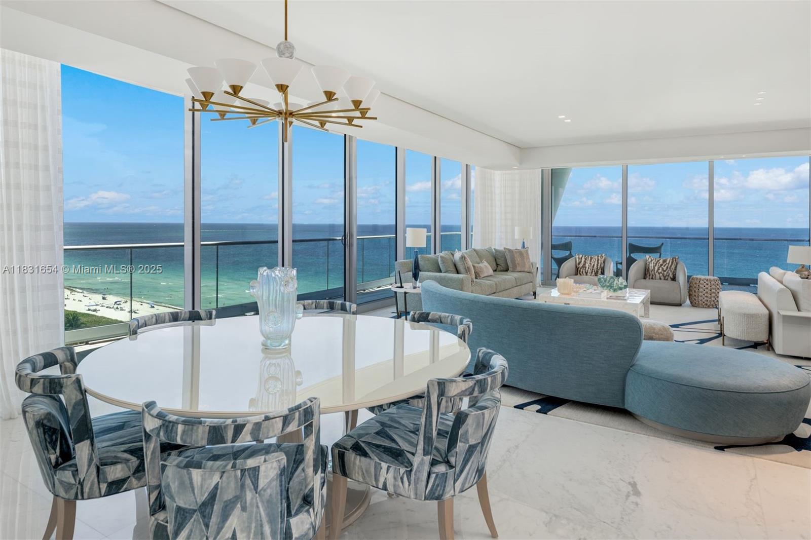 9349 Collins Avenue, Unit 1101 Surfside, FL 33154 - Photo 5 of 37 a dining room with furniture a chandelier and window