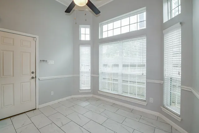 a view of an empty room with a window
