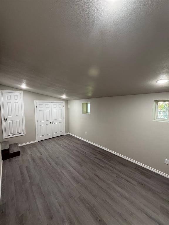 4812 Barbara Road River Oaks, TX 76114 - Photo 15 of 20 an empty room with wooden floor and windows
