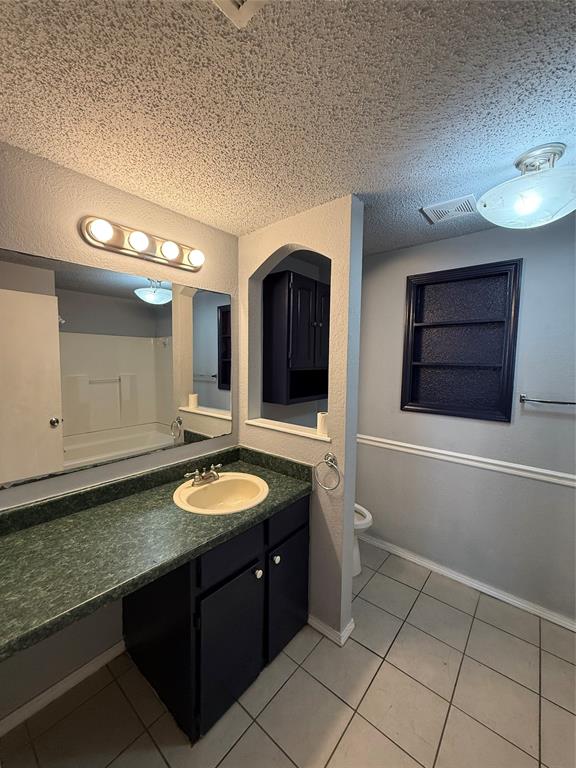 4812 Barbara Road River Oaks, TX 76114 - Photo 3 of 20 a bathroom with a granite countertop sink and a mirror