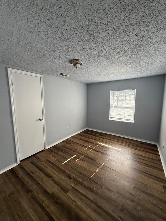 4812 Barbara Road River Oaks, TX 76114 - Photo 5 of 20 a view of empty room with wooden floor and fan