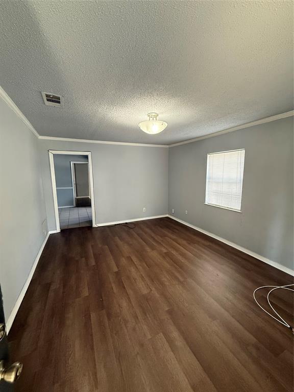 4812 Barbara Road River Oaks, TX 76114 - Photo 7 of 20 an empty room with wooden floor and windows