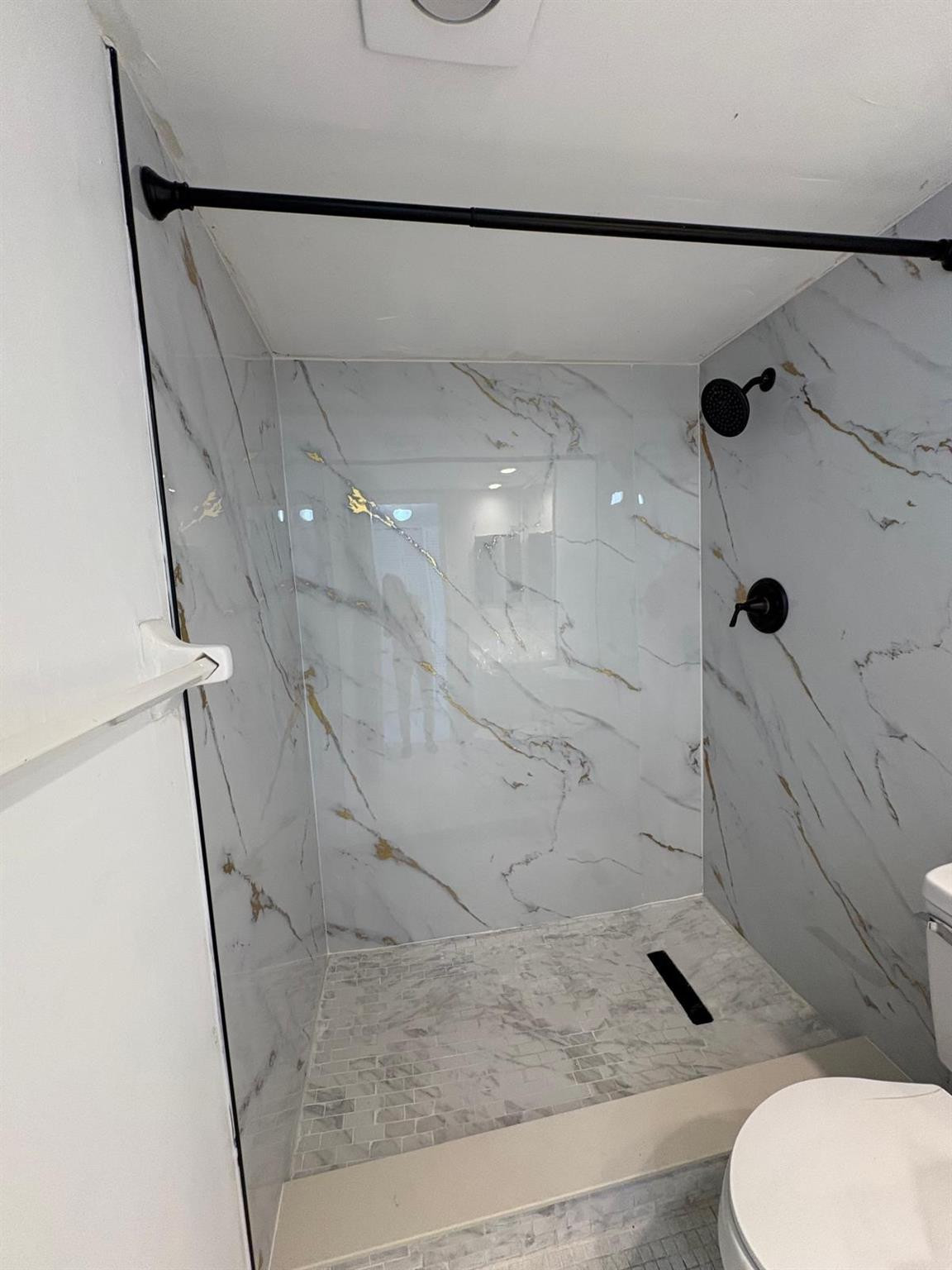 3150 North Course Lane, Unit 607 Pompano Beach, FL 33069 - Photo 14 of 16 a bathroom with a sink and a toilet